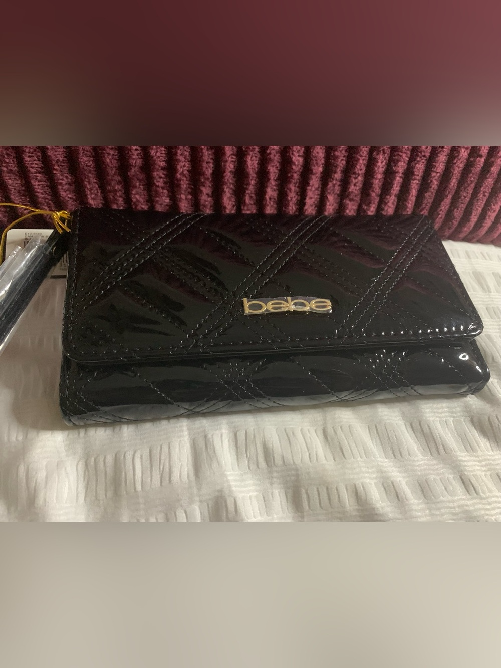 bebe Black Quilted Patent Fold-Over wallet with Gold Logo